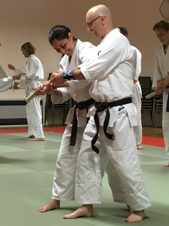 Aikido training with weapons guidance